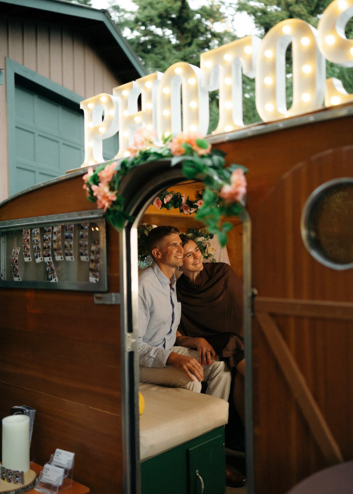 Couple smiling together inside the trailer booth