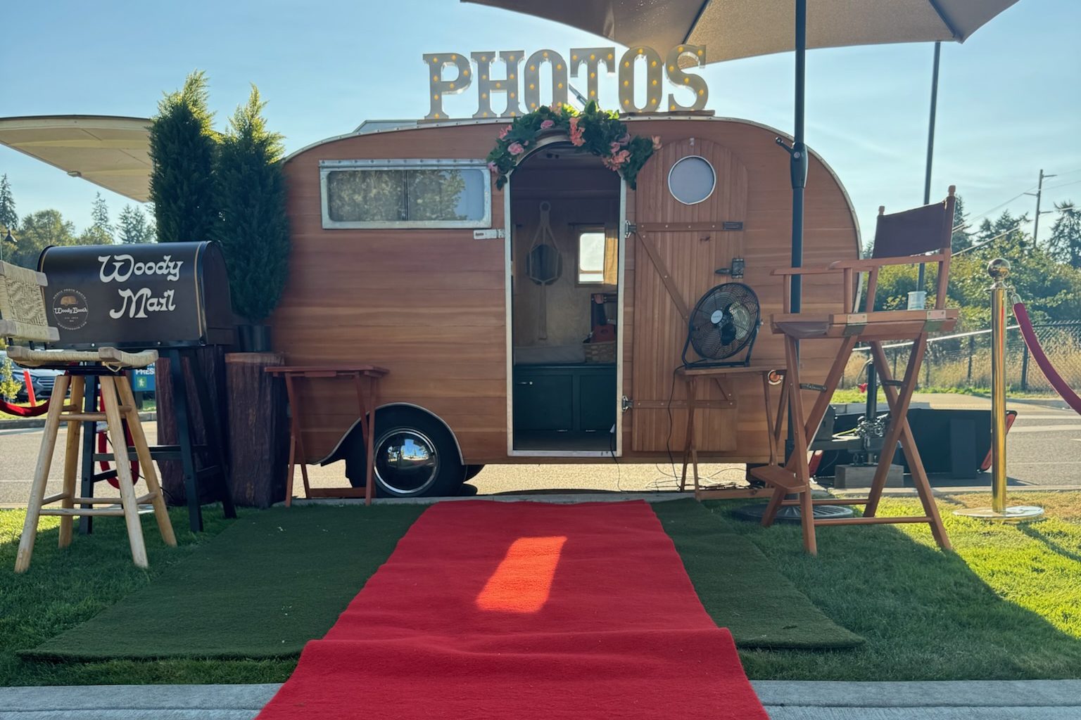 Woody Booth vintage trailer with red carpet entrance
